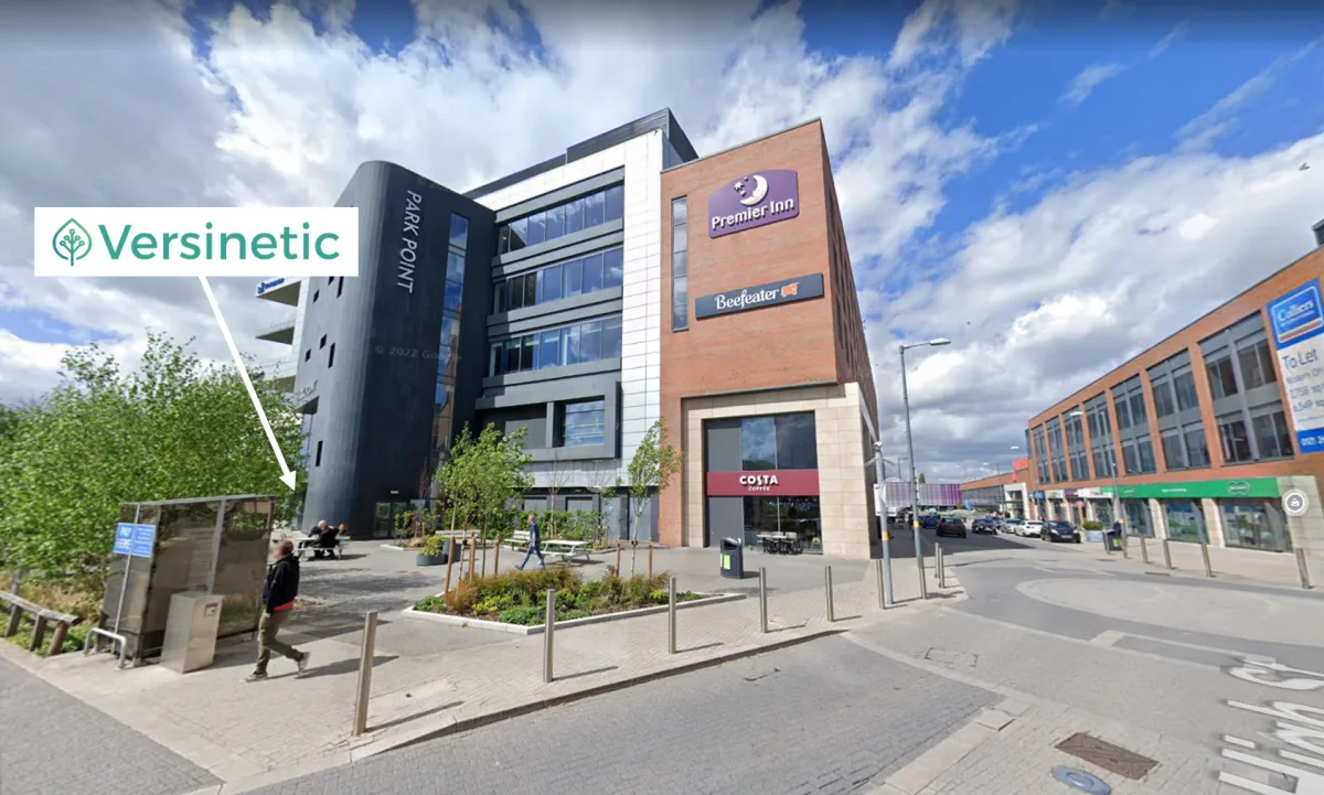 The entrance to Park Point, the tall grey building on Longbridge high street where Versinetic is based on the 3rd floor